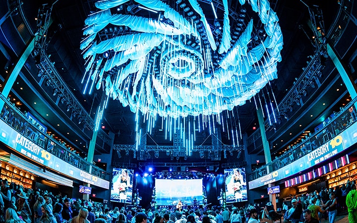 Hurricane Hall at Luke Combs' Category 10 with the storm light installation over the main floor