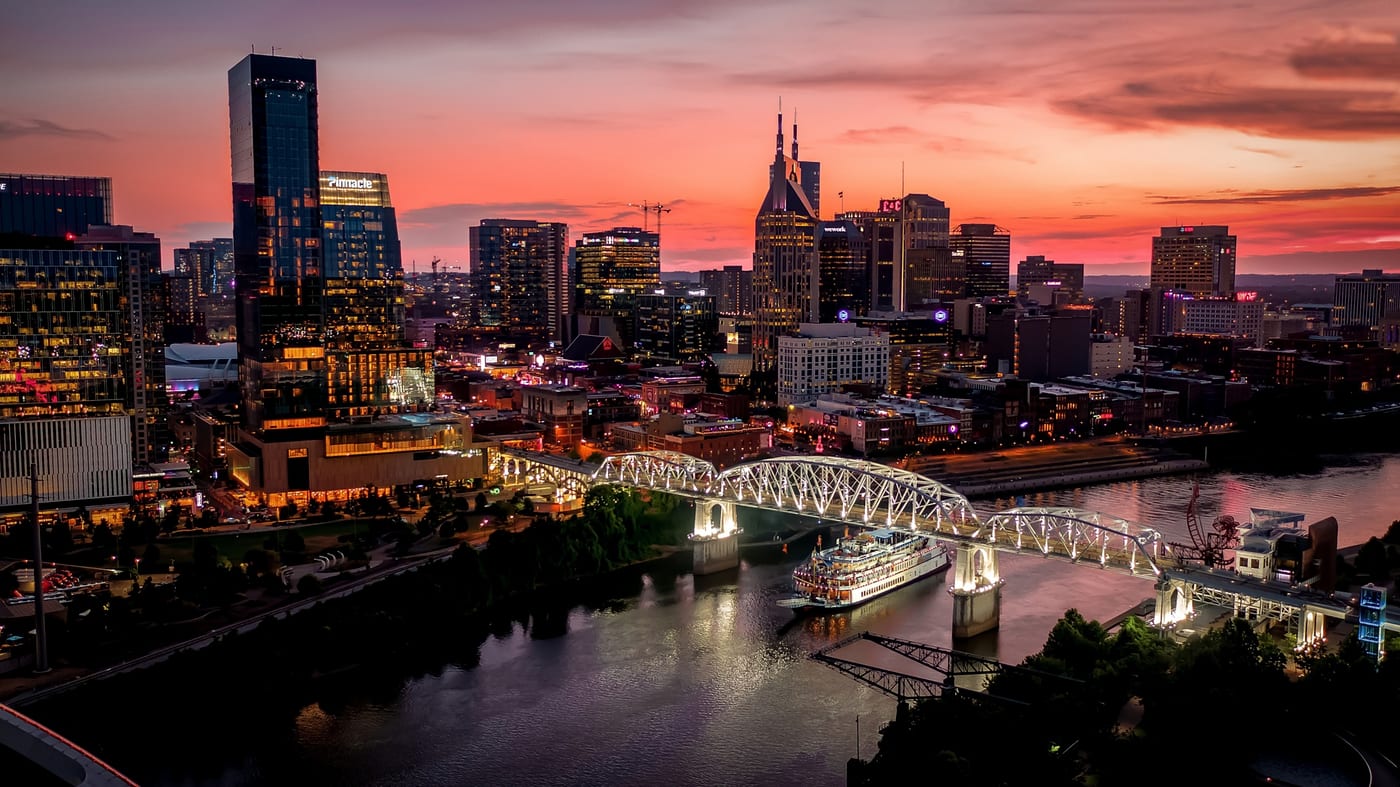 Downtown Nashville skyline at sunset with the General Jackson Showboat on the Cumberland River